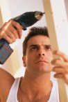 Man Using Electric Drill